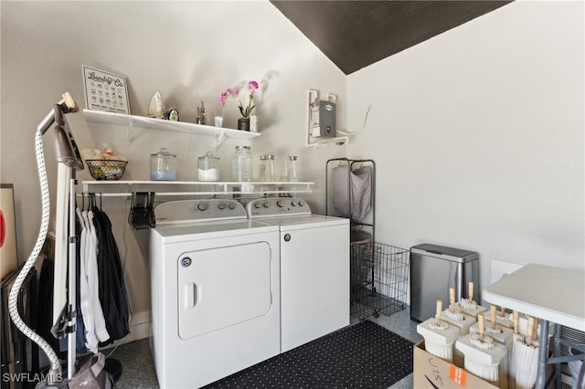 laundry area featuring washing machine and clothes dryer