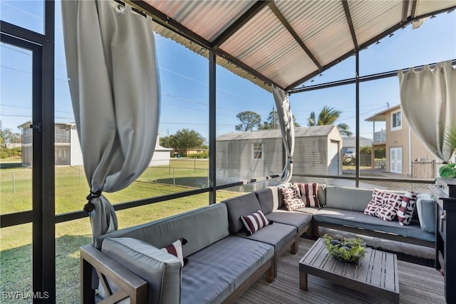 sunroom / solarium featuring lofted ceiling