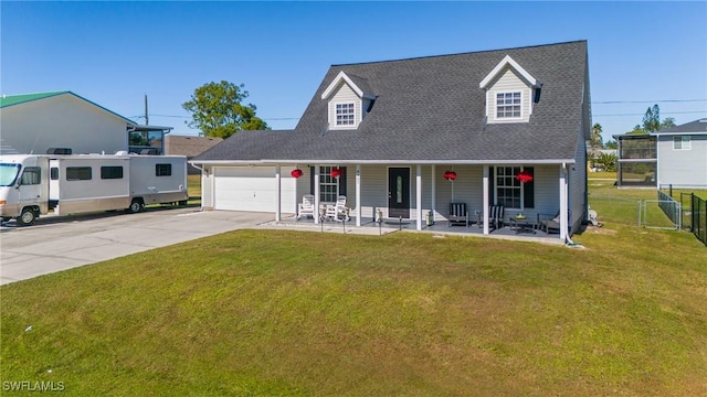 cape cod house with a porch, a garage, and a front lawn