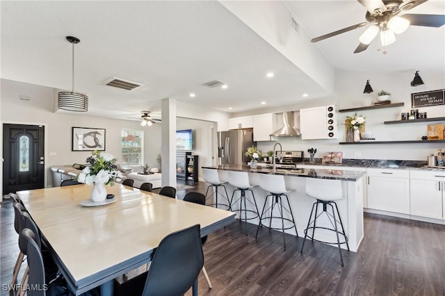 dining room featuring dark hardwood / wood-style flooring and sink