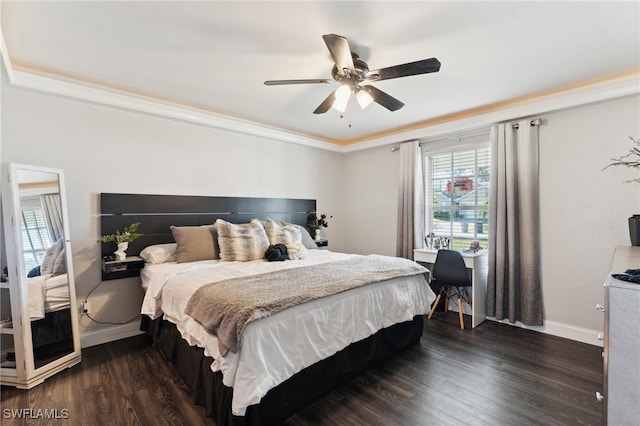 bedroom featuring ceiling fan, ornamental molding, and dark wood-type flooring