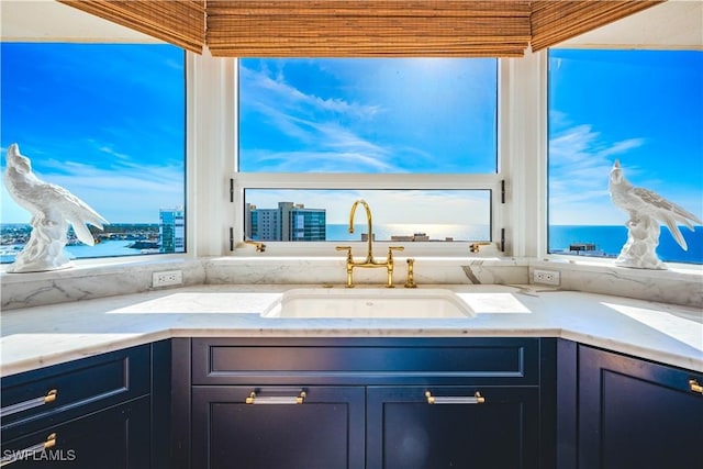 interior space with a water view and sink