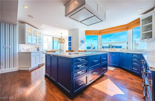 kitchen featuring blue cabinetry, white cabinetry, and pendant lighting