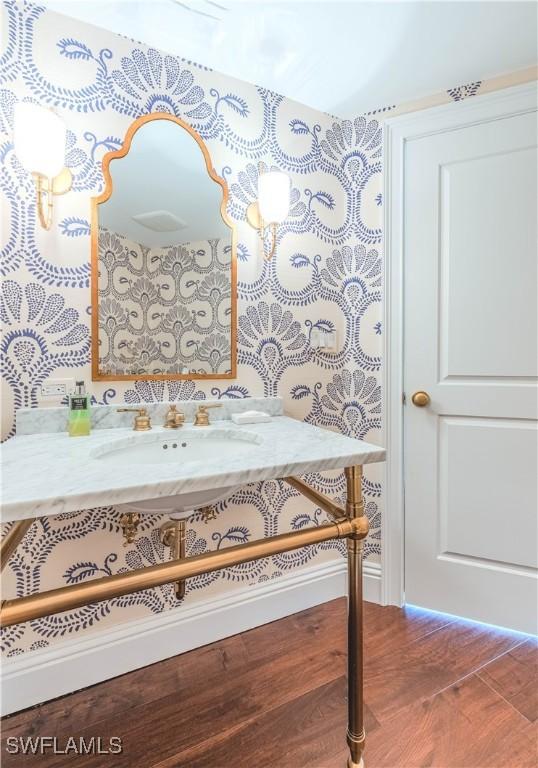 bathroom featuring hardwood / wood-style flooring and vanity