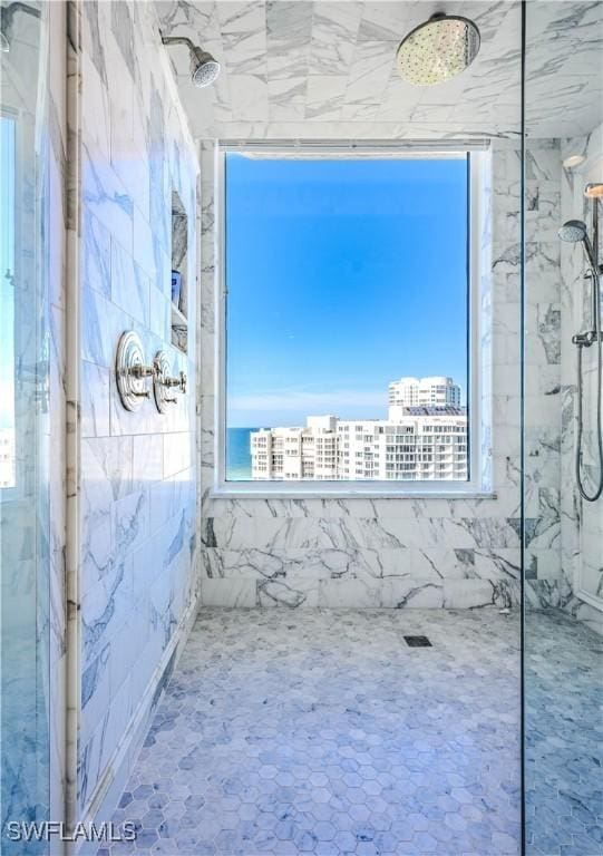 bathroom with a tile shower