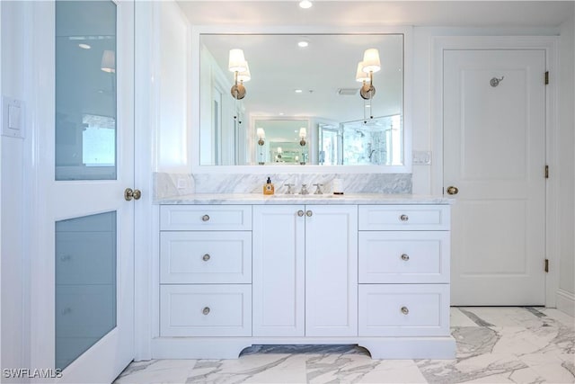 bathroom with vanity and walk in shower