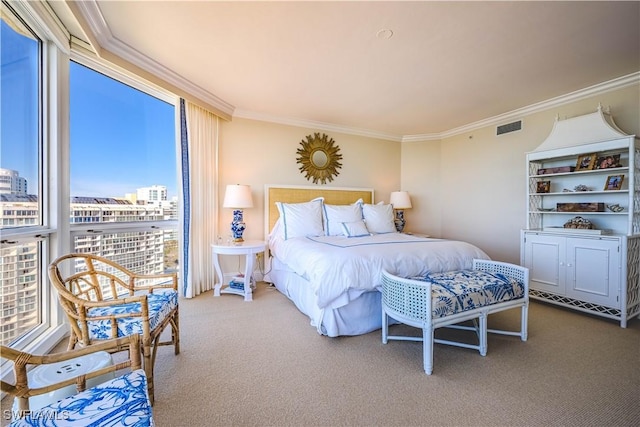 carpeted bedroom with ornamental molding