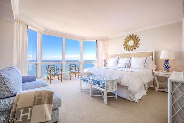 bedroom with carpet flooring, a wall of windows, a water view, and ornamental molding