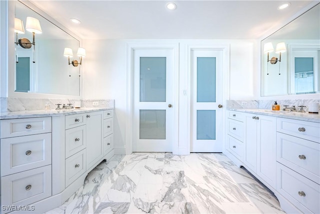 bathroom featuring vanity and decorative backsplash