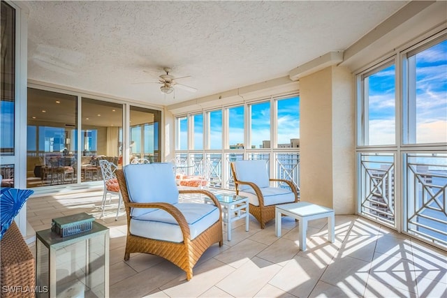 sunroom with ceiling fan