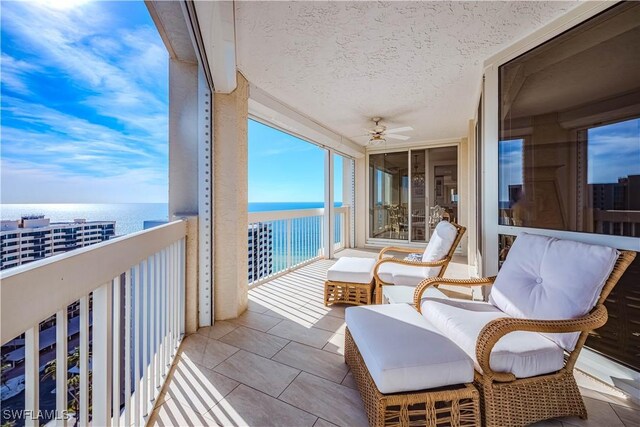 balcony featuring a water view