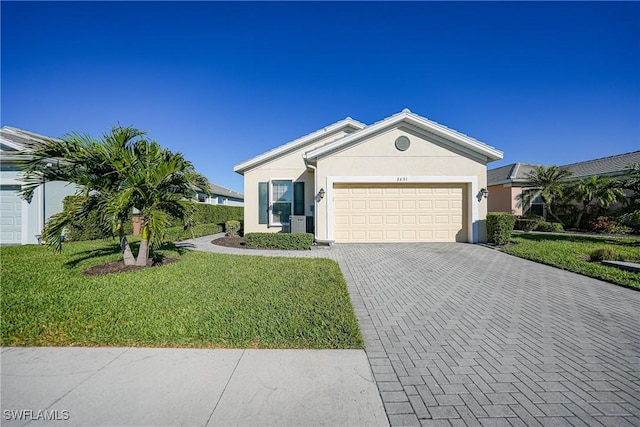 single story home featuring a front yard and a garage