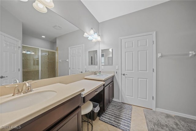 bathroom with vanity, tile patterned floors, and walk in shower