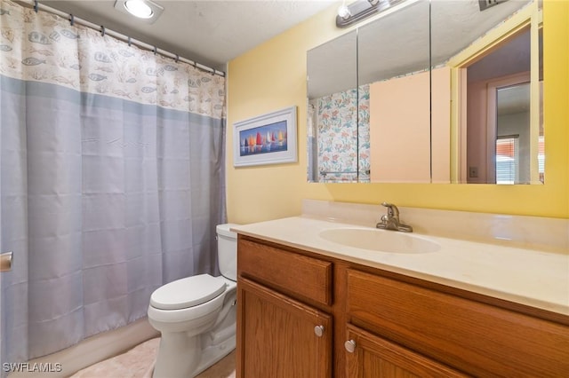 bathroom featuring a shower with curtain, vanity, and toilet