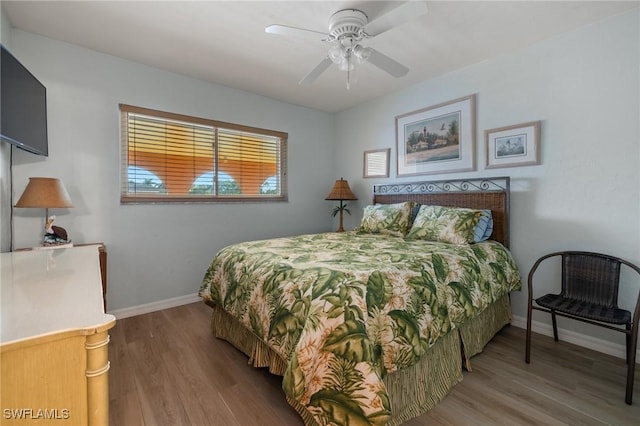 bedroom with hardwood / wood-style flooring and ceiling fan