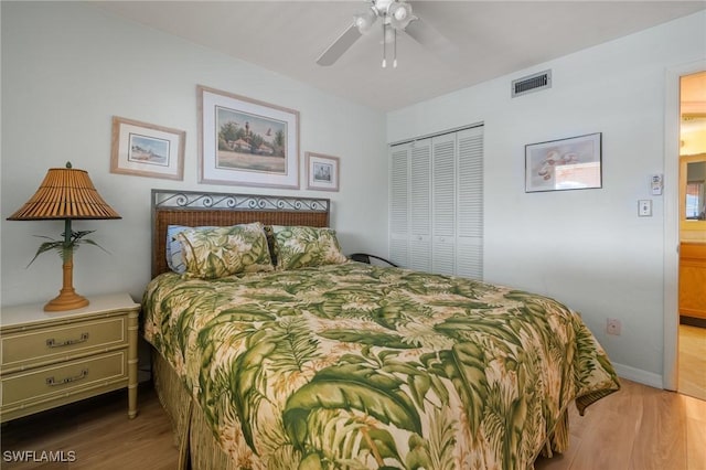 bedroom with a closet, ceiling fan, and light hardwood / wood-style flooring