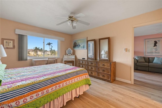 bedroom featuring ceiling fan and light hardwood / wood-style flooring