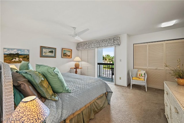 carpeted bedroom with access to exterior, ceiling fan, and a closet