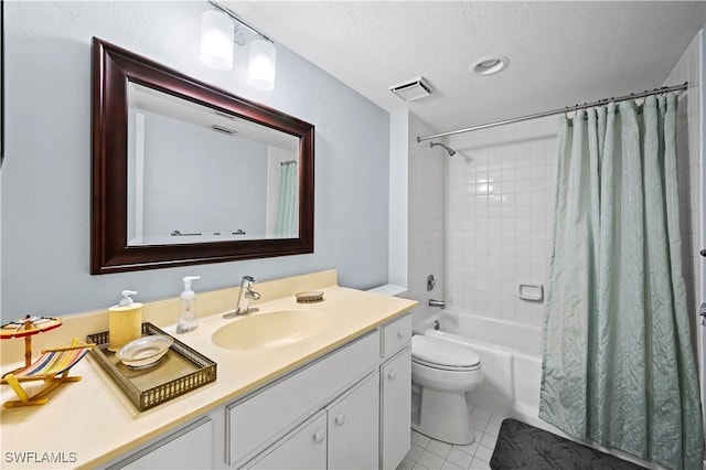 full bathroom featuring toilet, a textured ceiling, vanity, shower / bath combo with shower curtain, and tile patterned flooring