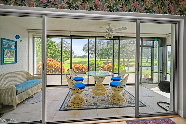 sunroom / solarium with ceiling fan