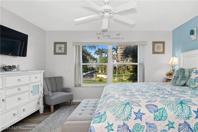 bedroom featuring ceiling fan and dark hardwood / wood-style floors