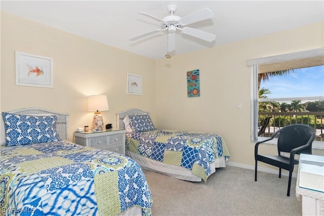 carpeted bedroom featuring access to exterior and ceiling fan