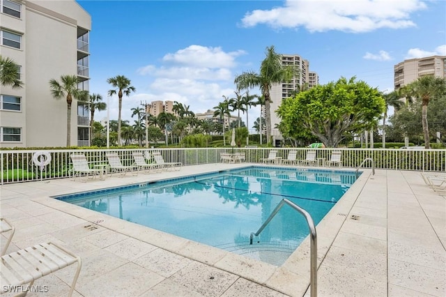 view of swimming pool featuring a patio area