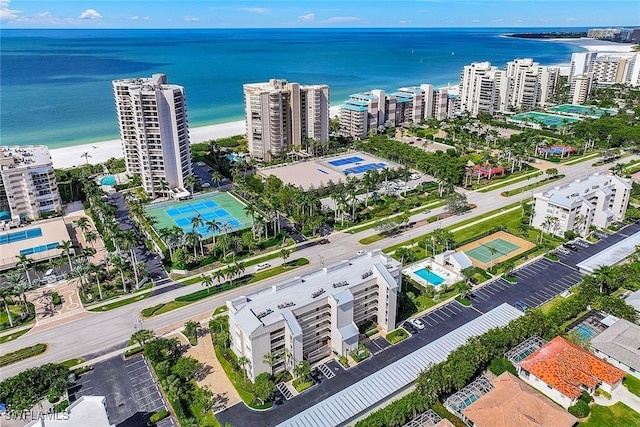 birds eye view of property featuring a water view and a view of the beach