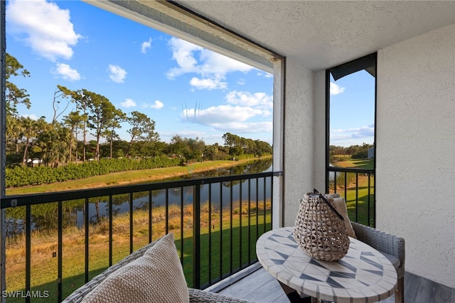 balcony featuring a water view