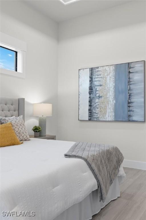 bedroom with light wood-type flooring