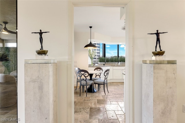 interior space featuring ceiling fan