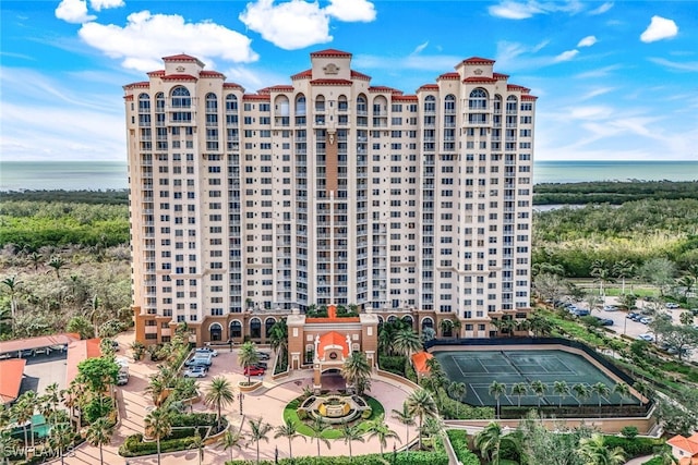 view of building exterior with a water view