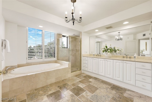 bathroom with vanity, plus walk in shower, and an inviting chandelier