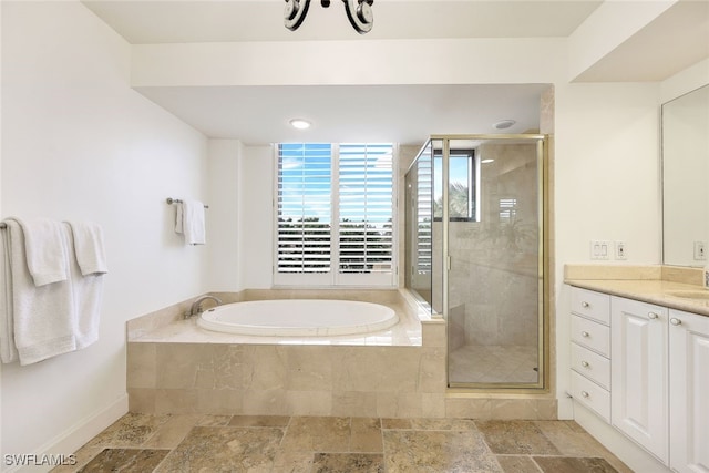 bathroom with shower with separate bathtub and vanity