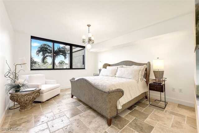 bedroom with a notable chandelier