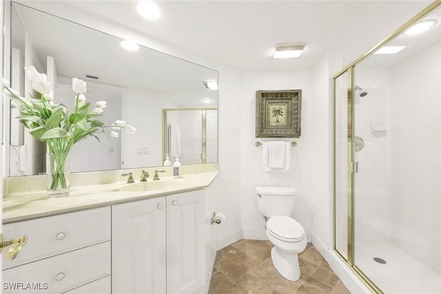 bathroom featuring vanity, toilet, and walk in shower