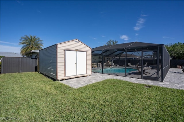 exterior space featuring a patio area, a shed, a lanai, and a lawn