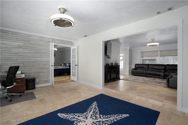 office space featuring crown molding, a fireplace, and a textured ceiling