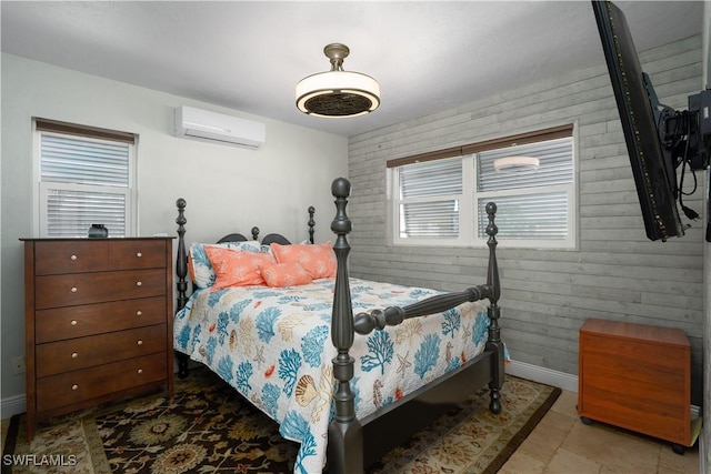 bedroom featuring a wall mounted AC