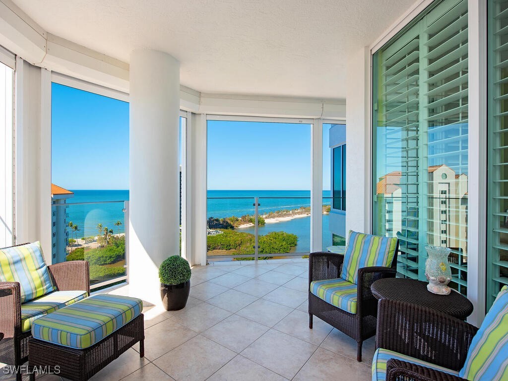 sunroom / solarium with a water view