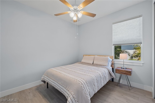 bedroom featuring ceiling fan and hardwood / wood-style floors