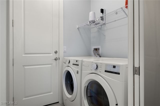 washroom with washer and dryer