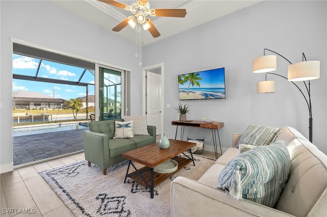 living room with ceiling fan and light tile patterned floors