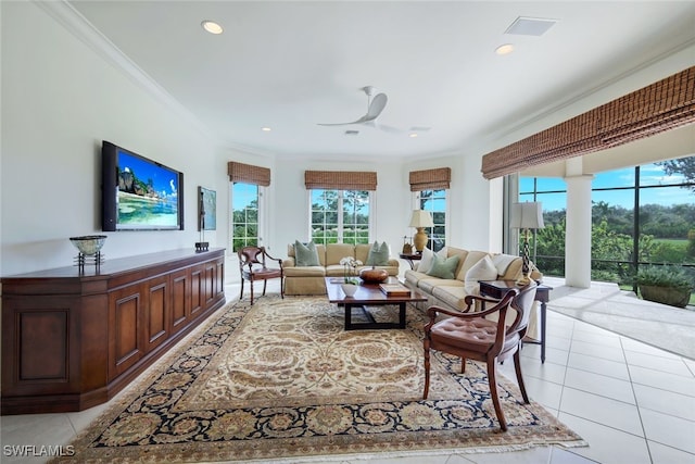 tiled living room featuring ceiling fan and ornamental molding