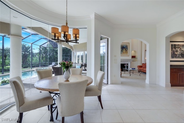 dining space featuring light tile patterned flooring, a notable chandelier, and ornamental molding