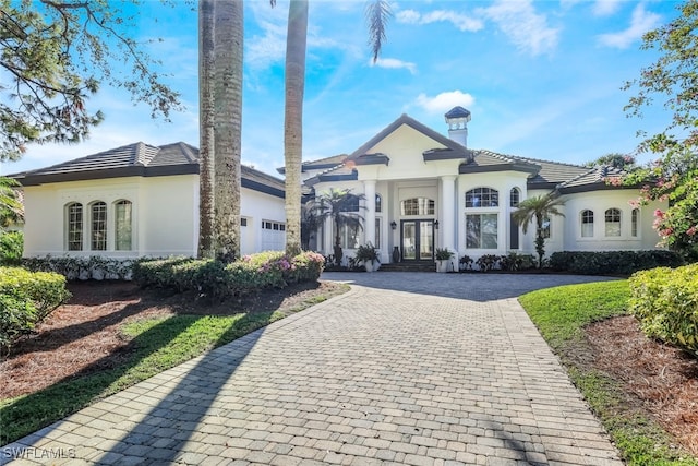 view of front of home featuring french doors and a garage