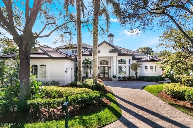 mediterranean / spanish home with french doors