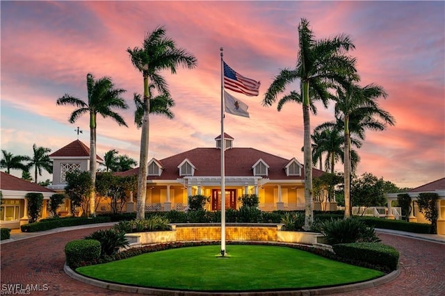 view of outdoor building at dusk