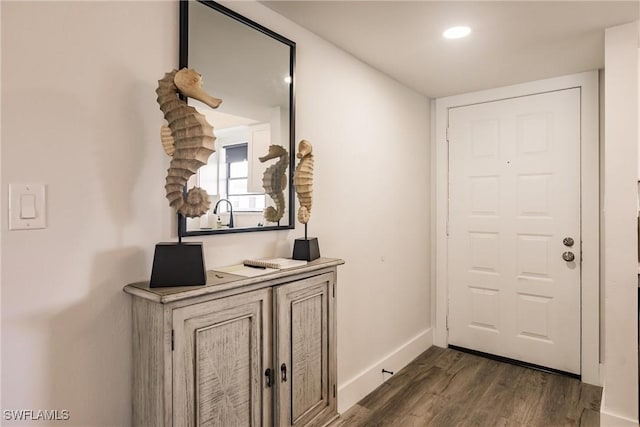 doorway featuring dark hardwood / wood-style flooring