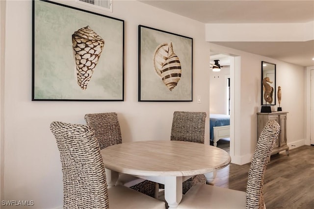 dining space featuring hardwood / wood-style floors and ceiling fan